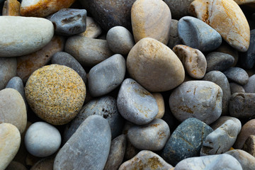close up background of muilticolored beach rocks