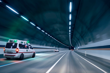 an ambulance passing through a tunnel