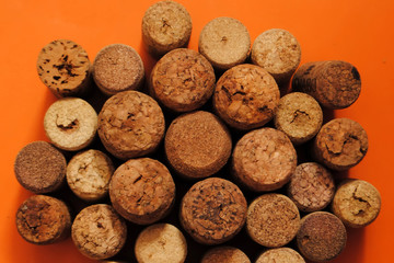 Wine corks on an orange background. Different wine corks.