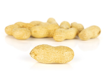 Lot of whole natural yellow peanut isolated on white background