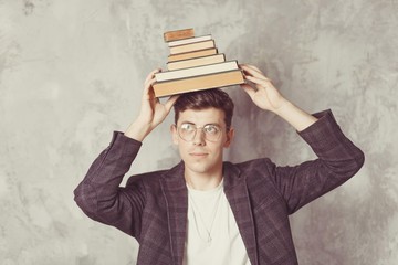 Young boy student with books in glasses. happy guy want learning, have education. online education....