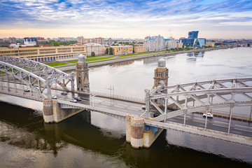 Fototapeta premium Saint Petersburg. Russia. Neva River. Bolsheokhtinsky bridge. White nights in Russia. View of St. Petersburg from a drone. Bridges of St. Petersburg. City center.
