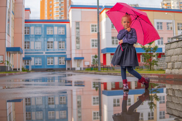 girl in the rain with an umbrella red