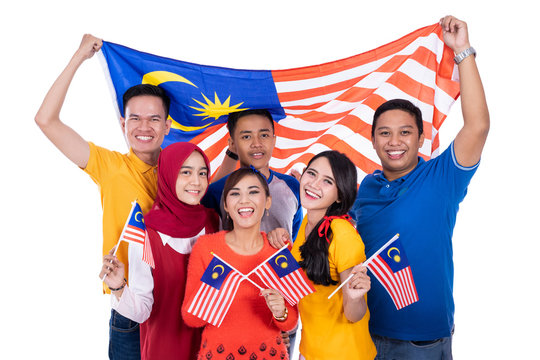 malaysia people holding flag celebrating independence day together