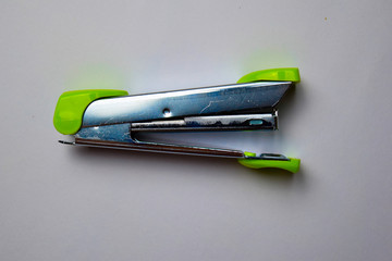 Close up Green stapler isolated on a white background