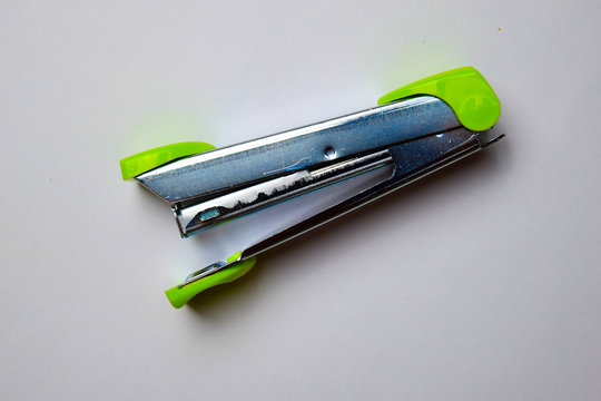 Close up Green stapler isolated on a white backgroundClose up Green stapler isolated on a white background