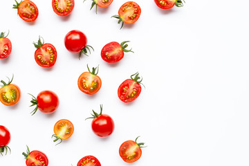 Fresh cherry tomatoes, whole and half cut isolated on white background.