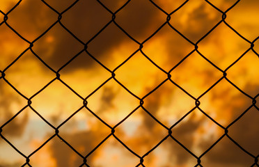 Fototapeta premium Grid with sunset clouds background