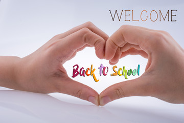 Hand making a heart shape