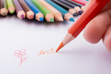 Hand drawing near pencils