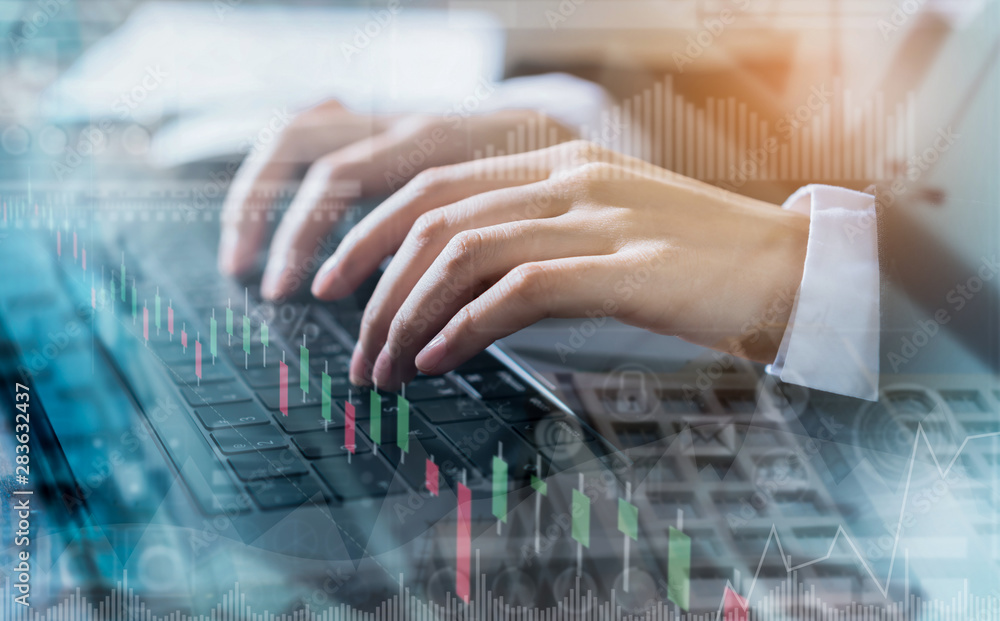 Aufkleber double exposure of hand businessman using computer laptop and financial graph on building background