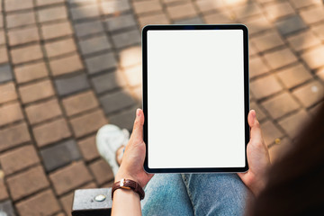 Hand holding digital tablet blank screen. mockup to screen to put products on advertising.
