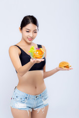 Beautiful young asian woman slim shape with diet choosing fresh salad vegetable and hamburger isolated on white background, food healthy with control for weight loss with calories, nutrition concept.