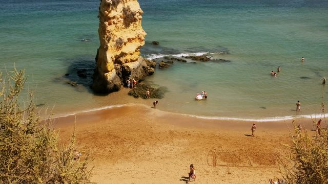 Wide elevated view of the Dona Ana beach in Lagos, The Algarve, Portugal, with beautiful rock formations and turquoise waters