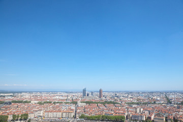 Fototapeta na wymiar Aerial panoramic view of Lyon with the skyline of Lyon skyscrapers visible in background and Saone river in the foregroud, with the narrow streets of Old Lyon district