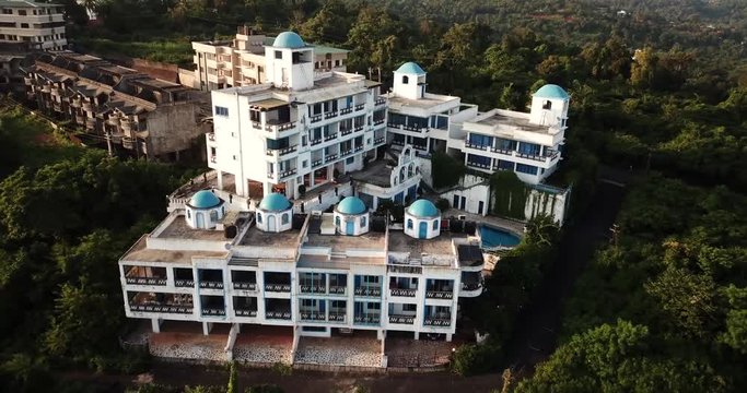Drone shot flying over beautiful architectural buildings