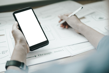 Fototapeta premium Mockup image of ux graphic designer creative smartphone application process development interface for web mobile phone, mockup concept