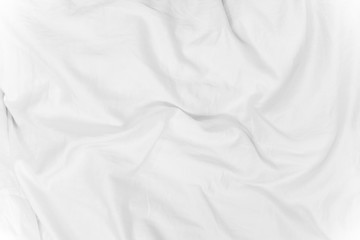 Obraz premium Abstract background from white corrugated fabric texture on bed with sunlight in the morning.