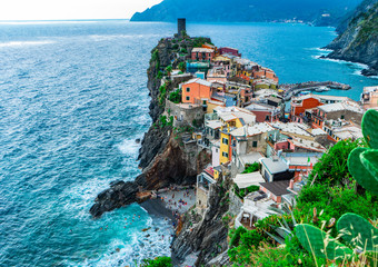 Amazing view over the village of Vernazza, one of the Cinque Terre in Italy. Viewpoint where we can see Doria Castle, a small beach and the colored houses of the ligurian region. Mediterranean sea.