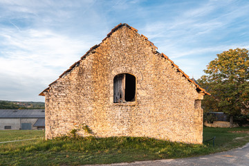 Fototapeta na wymiar An old French farm house symmetrical in middle of frame
