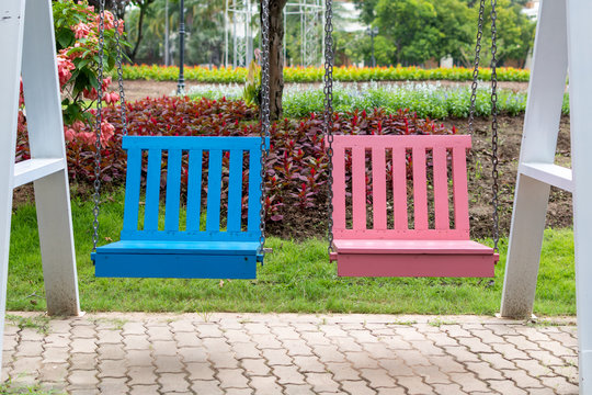 Colorful wooden swings in the park