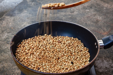 Traditional roasting coffee at home,  freshly roasted coffee beans.
