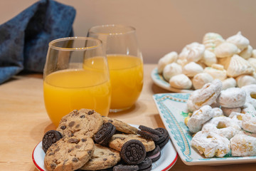  rich, but a lot of sugar on this table of sweets and natural orange juice