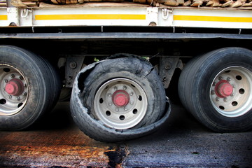 Damaged truck tires.damaged 18 wheeler semi truck burst tires by highway street.damaged tire after tire explosion at high speed on highway.
