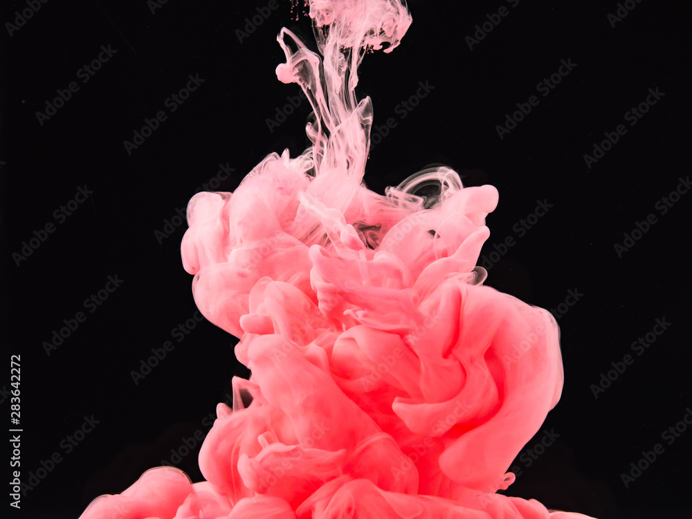 Poster pink ink dropped into water isolated on black background, close up view. abstract swirl dissolving i