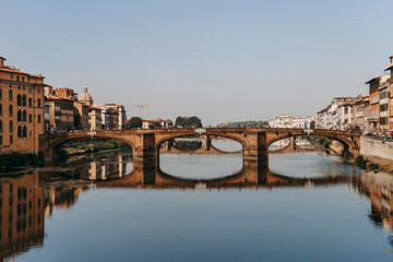 Obraz premium Ponte Santa Trinita bridge over the Arno river | FLORENCE, ITALY - 14 SEPTEMBER 2018.
