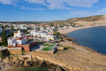 Fort and beautiful beach, Praia da Luz, Algarve, Portugal, summer aerial drone wide view