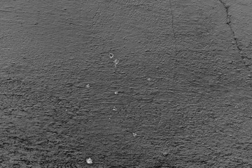 Texture of a concrete wall with cracks and scratches which can be used as a background
