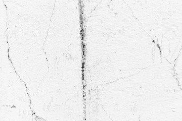 Texture of a concrete wall with cracks and scratches which can be used as a background
