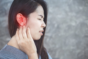 Asian woman has pain in the ear, Tinnitus concept