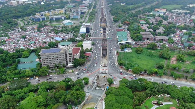 Bird eye view of the huge long highway of Don Mariano Marcos Avenue and the nice green City.