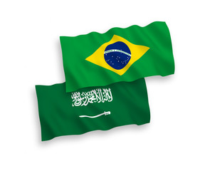 National vector fabric wave flags of Saudi Arabia and Brazil isolated on white background. 1 to 2 proportion.