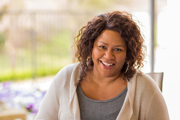 Beautiful mature African American woman smiling and laughing.