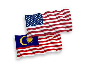 Fototapeta premium National vector fabric wave flags of Malaysia and USA isolated on white background. 1 to 2 proportion.