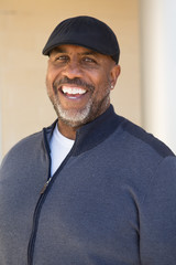 Portrait of an African American sitting outside.