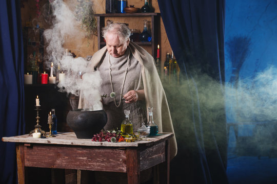 elderly alchemist monk brews  magic potion