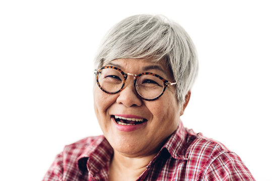 Portrait of happy senior adult elderly asia women smiling and looking at camera on white background.Retirement concept