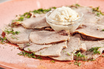 Delicatessen restaurant dish of thinly sliced boiled beef tongue