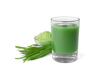 Glass of wheat grass juice, bowl with powder and sprouts on white background