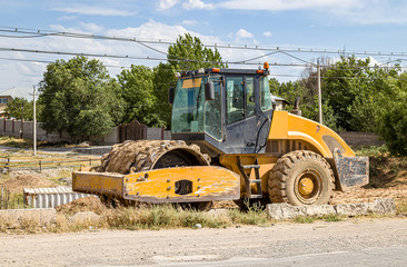Tractor for soil compaction close-up. Road construction equipment.