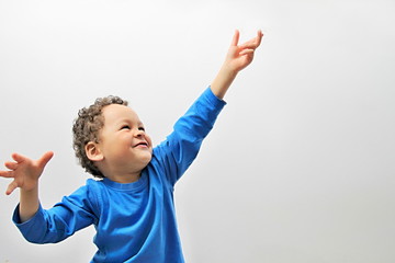 boy reaching for to the sky stock image on white background stock photo