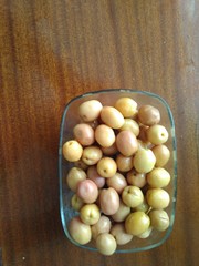 tasty olives in glass bowl on table