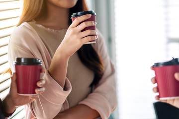 People enjoyed talking and drinking coffee together in office