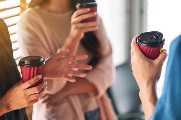 People enjoyed talking and drinking coffee together in office