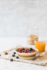 healthy breakfast with gran fruits and orange juice