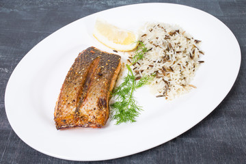 Griiled salmon fillet with basmati rice.